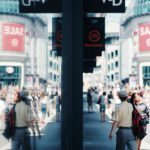 people walking beside buildings