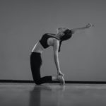 a woman doing yoga in a room
