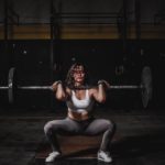 woman lifting barbell