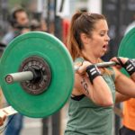 photo of a woman lifting a barbell
