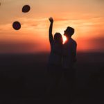 silhouette photo of couple standing outdoors