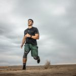 man running on sand field
