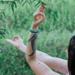 tranquil woman doing yoga in park