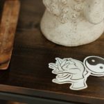 white ceramic vase on brown wooden table