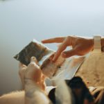 person holding a plastic bag with tobacco