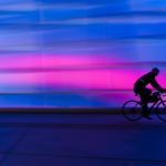 silhouette of person riding on commuter bike