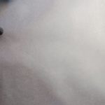 gray dumbbell beside wall